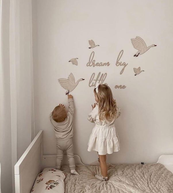 Wooden set of geese with the text "Dream big little one"